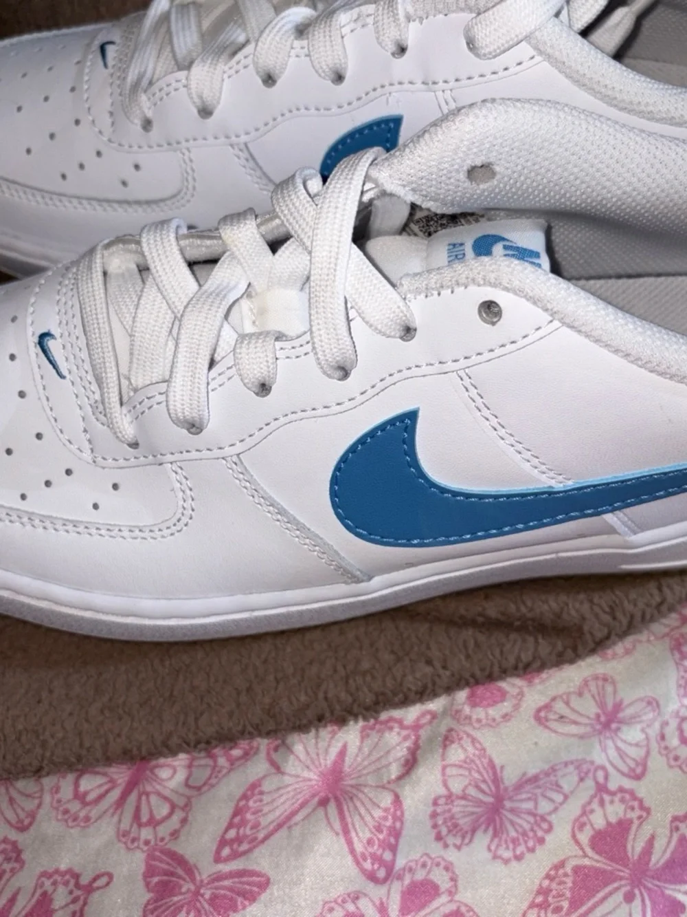 Nike White Sneakers with Blue Swoosh